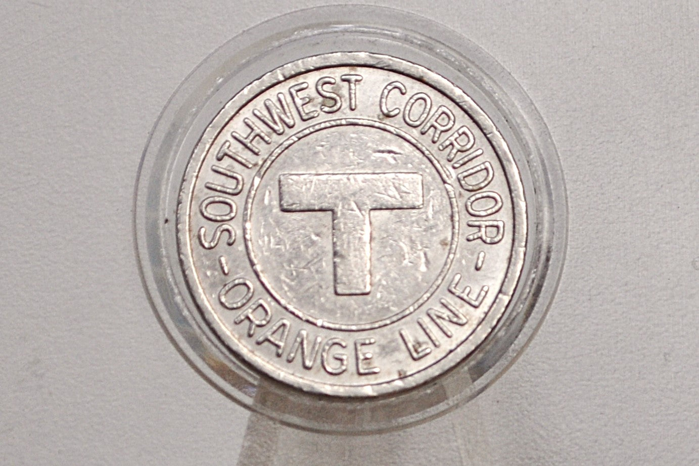 Boston MBTA Orange line transit token - Orange Line southwest corridor token opening May 1987