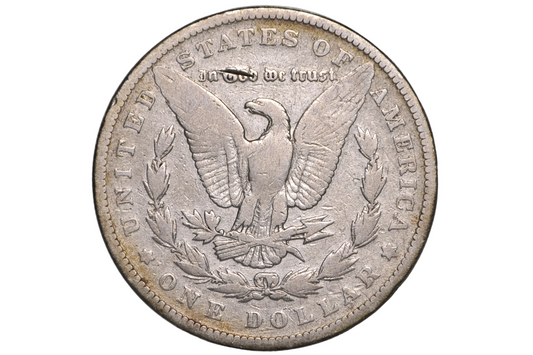 A silver US one dollar coin featuring an eagle and laurel wreath, displayed inside a clear plastic protective holder.