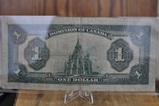 1923 One Dollar Dominion of Canada - VF (Very Fine) - Purple Seal, C Series, Very Rare Type for this Note - McCavour-Saunders - Higher Grade