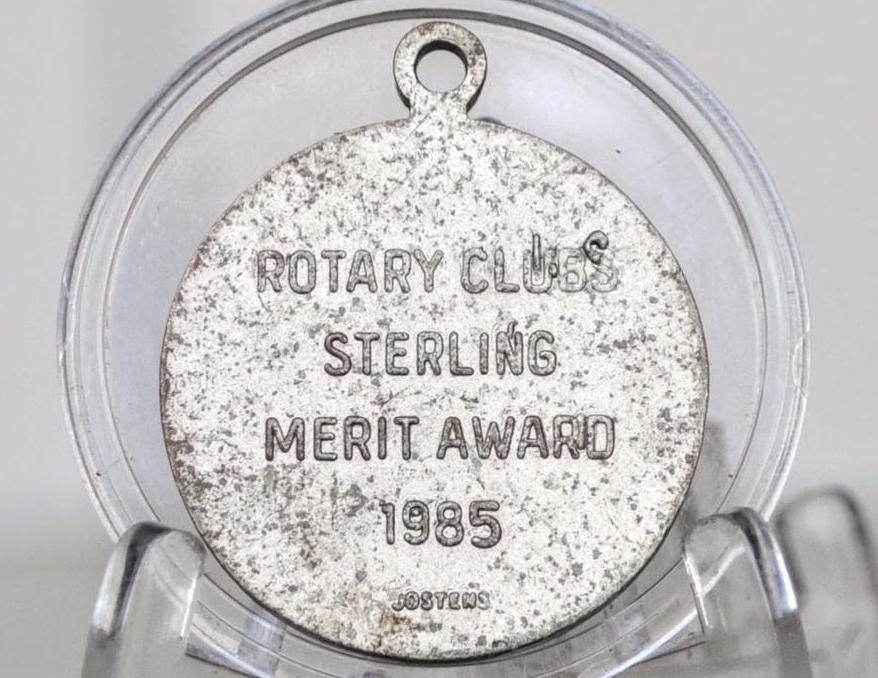 1985 Rotary International Merit Token for Superior Scholastic Achievement - Rotary Class Sterling Metal Award