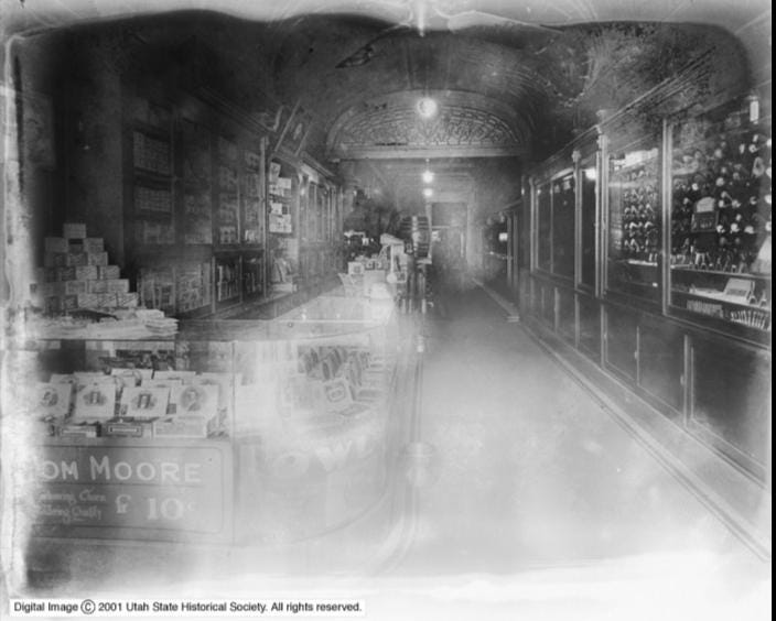 Hemenway and Moser Co., Ogden, Utah "Good For" 12 1/2 Cent Cigar Token with center cut bell shape - Brass Utah Token Hemenway and Moser Co.,