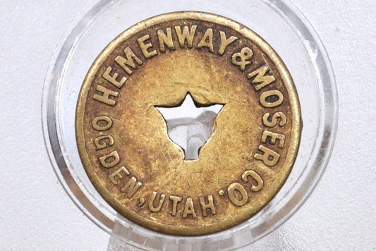 Hemenway and Moser Co., Ogden, Utah "Good For" 12 1/2 Cent Cigar Token with center cut bell shape - Brass Utah Token Hemenway and Moser Co.,