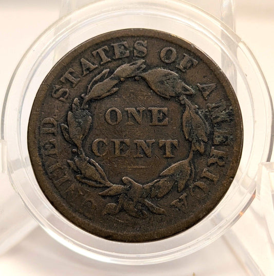 Vintage one cent coin from the United States of America in a clear protective case.