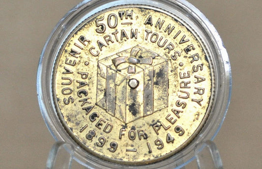 Packaged for Pleasure" 50th Anniversary Cartan Tours Souvenir Token - Cartan Tours Anniversary, Goodluck, and Spinner Token