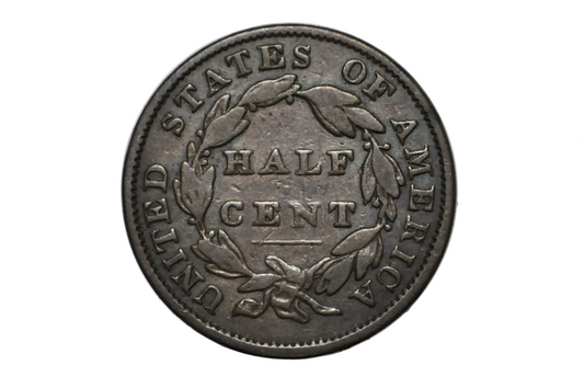 A vintage United States half cent coin with a dark metallic finish, displayed inside a clear plastic protective capsule on a white background.