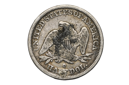 A vintage United States half dollar coin displayed inside a clear plastic protective capsule on a small clear stand, photographed against a light gray background. O Mint Mark