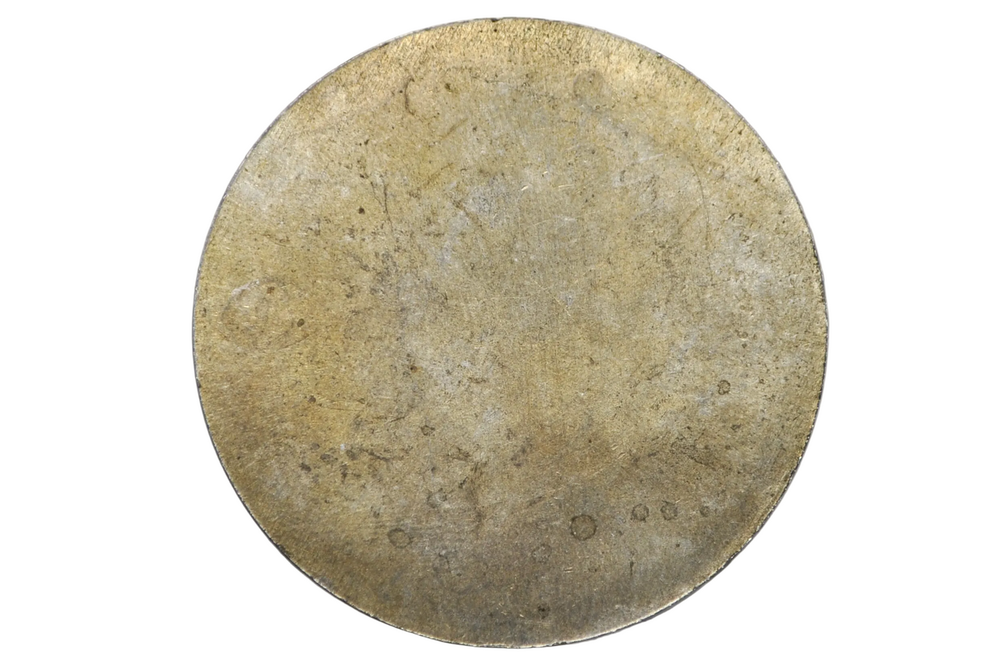 A round, textured gold-toned disc, likely a vintage coin or collectible medallion, displayed inside a clear plastic circular holder against a light gray background.