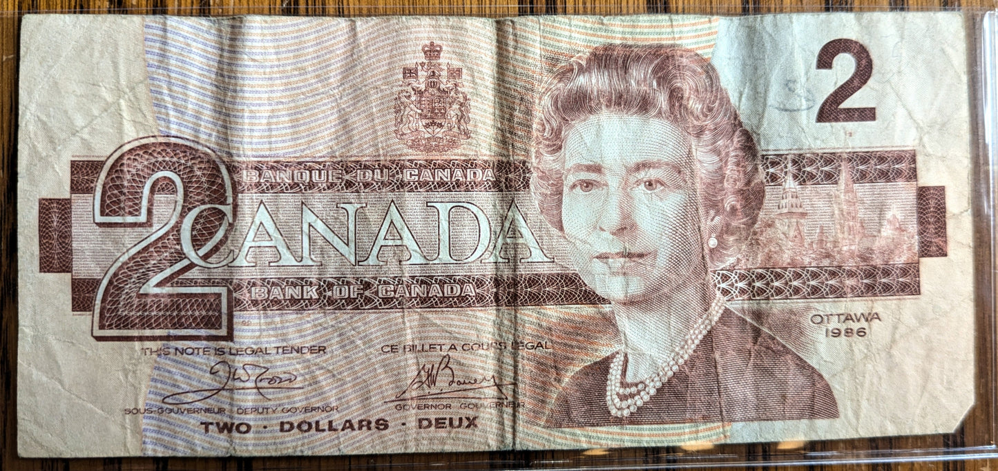 1986 Canadian 2 Dollar Banknote - Choice of Grade - Thiessen/Crow or Crow/Bouey Signed - 1986 Canada Two Dollar Bill - P#94a/P#94b