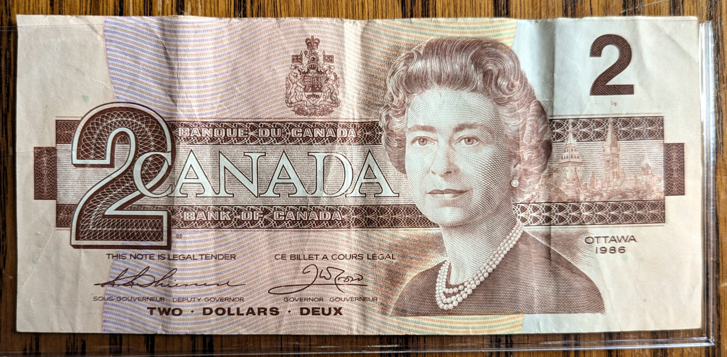1986 Canadian 2 Dollar Banknote - Choice of Grade - Thiessen/Crow or Crow/Bouey Signed - 1986 Canada Two Dollar Bill - P#94a/P#94b