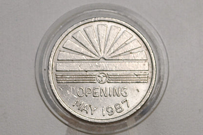 Boston MBTA Orange line transit token - Orange Line southwest corridor token opening May 1987