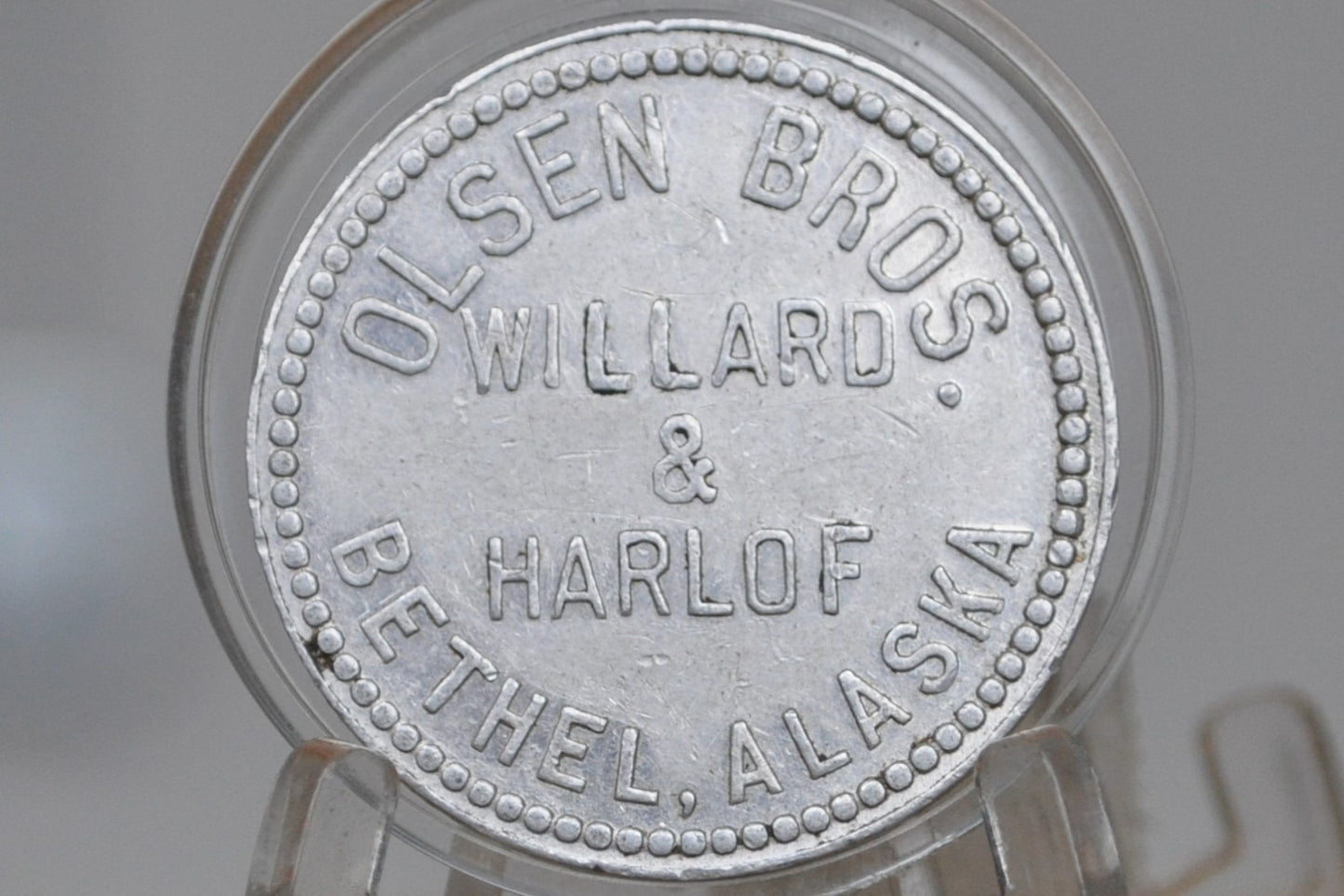 Bethel, Alaska Aluminum Trade Token by Olsen Bros. Willard & Harlof - Olsen Bros. One Dollar Trade Token&