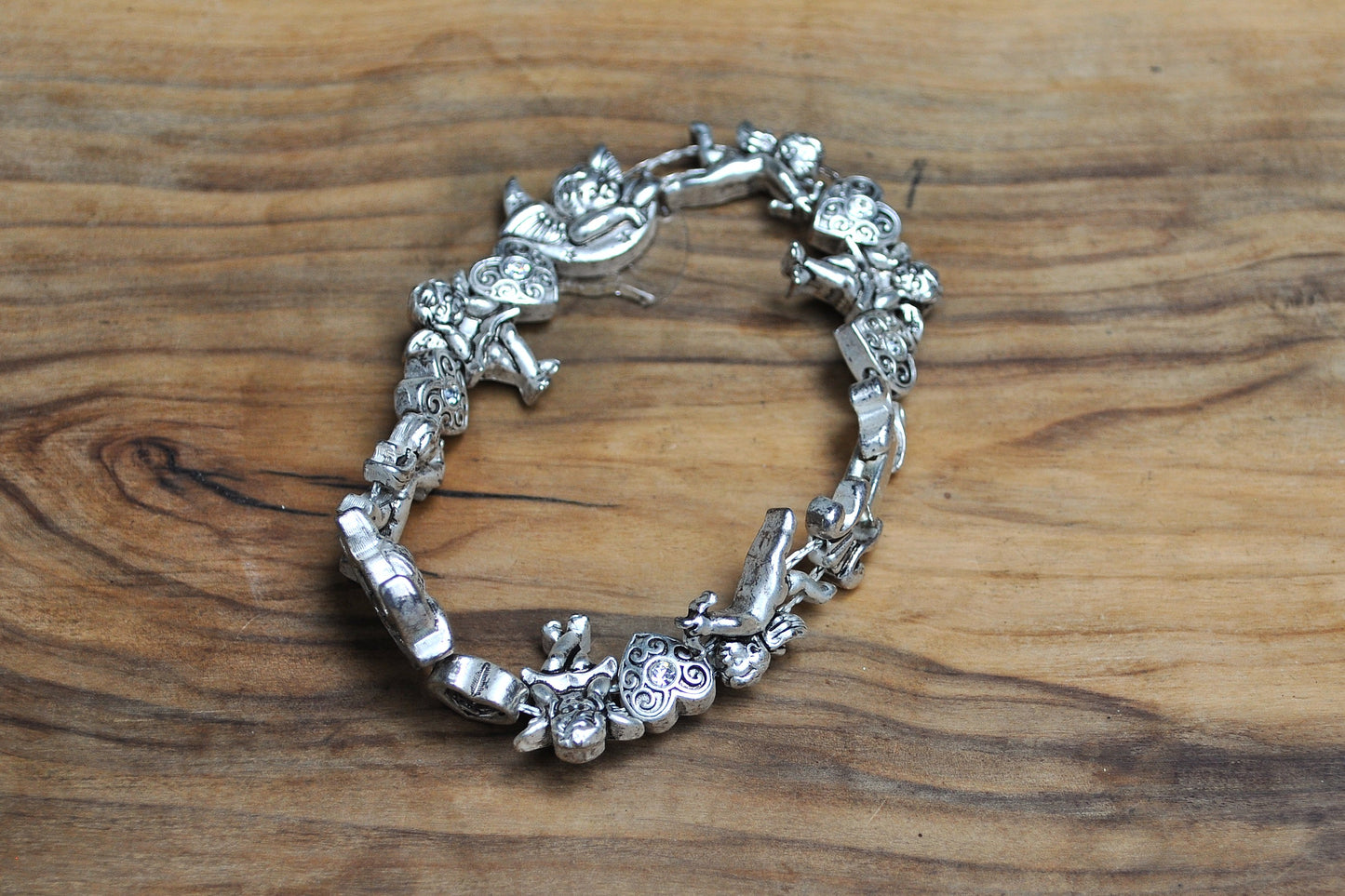 Cute Avon Valentines Day Silver Tone Cupid Bracelet - 8.5 Inches - Angel/Cupid/Cherub Bracelet - Adorned with Rhinestone Hearts