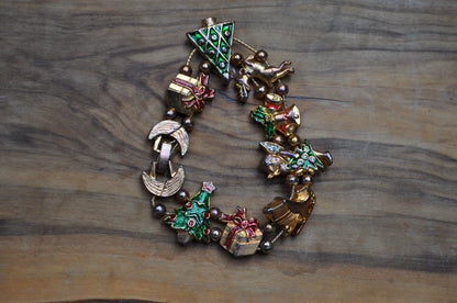 Festive Tofa Gold Tone Enamel Sliding Charm Christmas Bracelet - 8 Inches - Presents, Trees, Bells