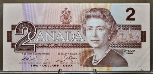1986 Canadian 2 Dollar Banknote - Choice of Grade - Thiessen/Crow or Crow/Bouey Signed - 1986 Canada Two Dollar Bill - P#94a/P#94b