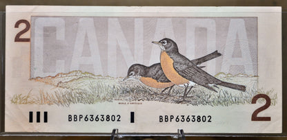 1986 Canadian 2 Dollar Banknote - Choice of Grade - Thiessen/Crow or Crow/Bouey Signed - 1986 Canada Two Dollar Bill - P#94a/P#94b