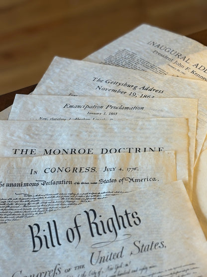 A folio of important American historical documents from American savings - 1950s-1960s prints of historic documents: Bill of Rights, Declaration of Independence, Monroe Doctrine, JFK Inaugural, etc.