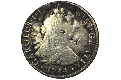 1784 Spanish 8 Reales featuring the bust of King Carolus III and chop marks from various places / merchants
