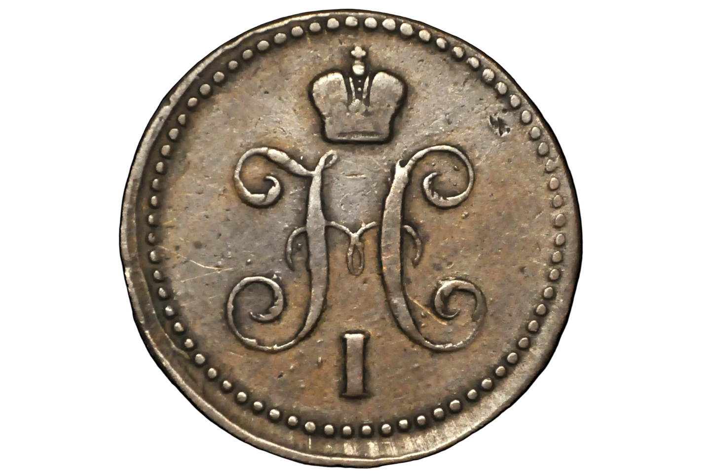 Vintage coin with a monogram and number 'I' on a black background