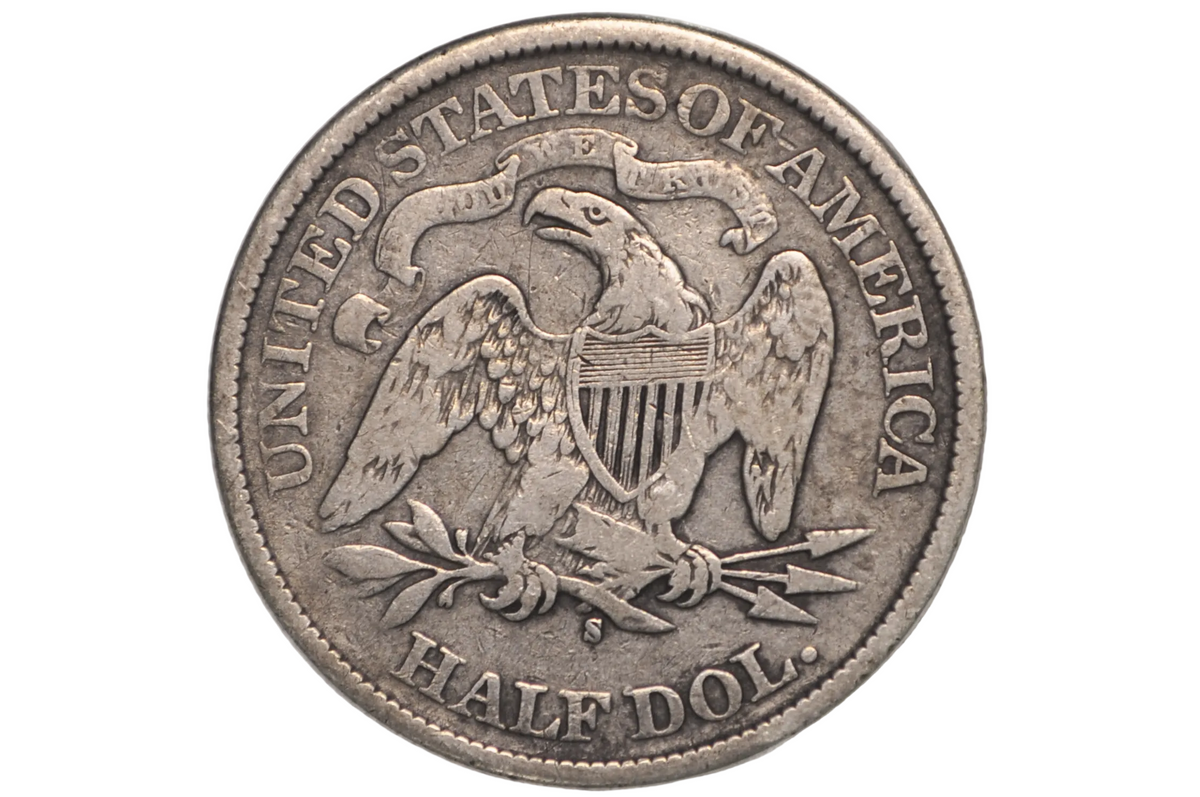 A silver United States of America half dollar coin featuring an eagle emblem, displayed inside a clear plastic grading holder.