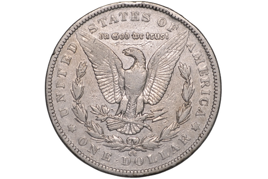 A silver US one-dollar coin featuring the Great Seal of the United States with the text 'In God we trust' and 'United States of America', displayed inside a clear plastic protective capsule.