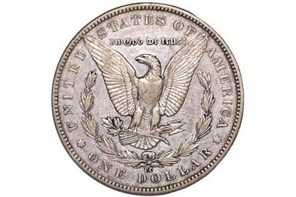 A silver United States one dollar coin featuring an eagle with outstretched wings, surrounded by the text 'IN GOD WE TRUST' and 'UNITED STATES OF AMERICA' and 'ONE DOLLAR', displayed inside a clear plastic protective capsule.