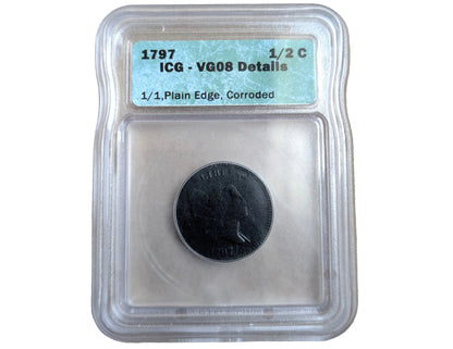 A 1797 US 1/2 Cent coin graded VG08 with a clear plastic encapsulation and a light blue label, placed on a beige textured surface.