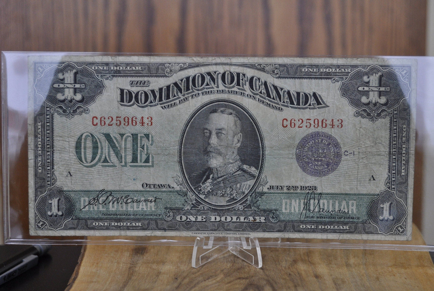 1923 One Dollar Dominion of Canada - VF (Very Fine) - Purple Seal, C Series, Very Rare Type for this Note - McCavour-Saunders - Higher Grade