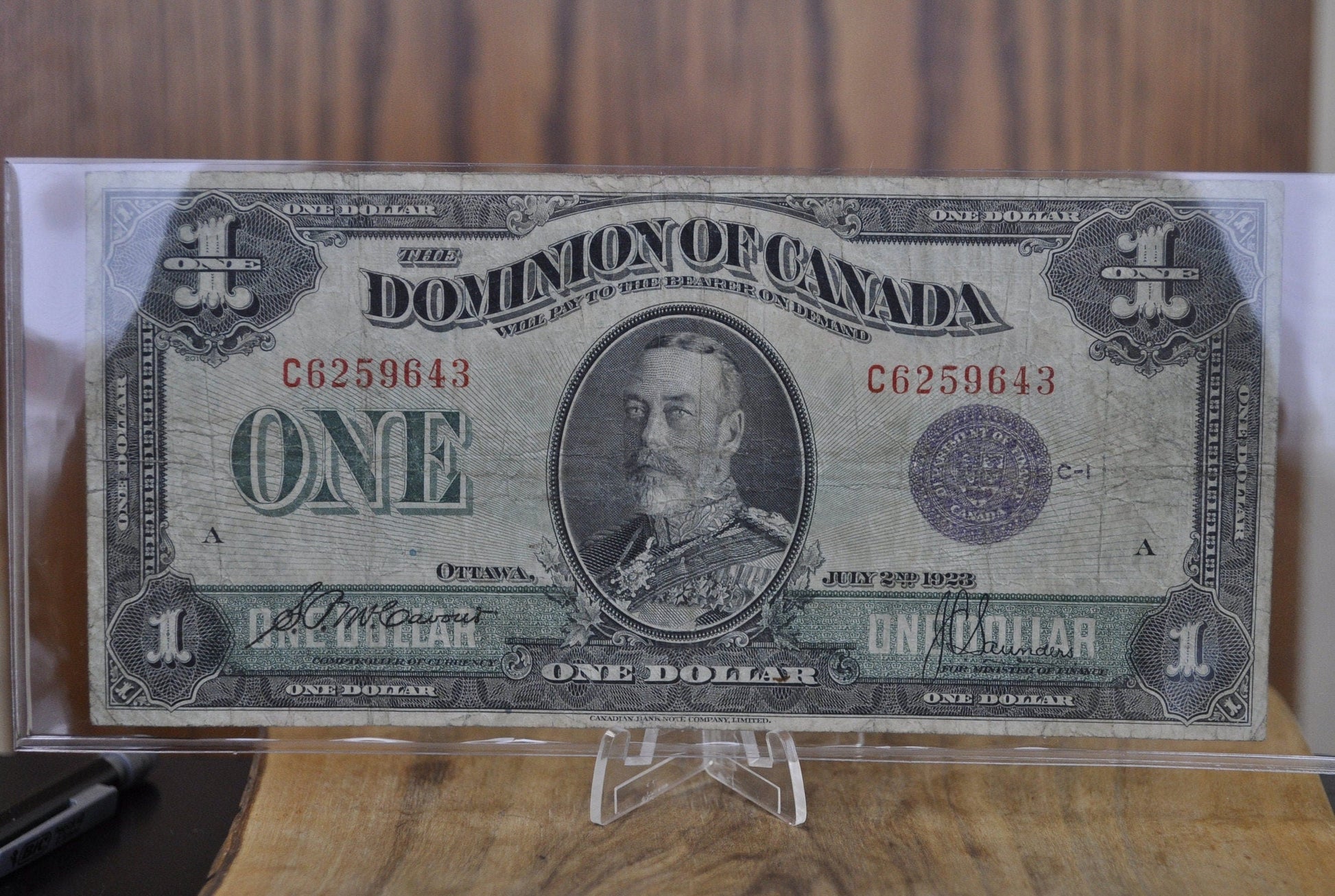 1923 One Dollar Dominion of Canada - VF (Very Fine) - Purple Seal, C Series, Very Rare Type for this Note - McCavour-Saunders - Higher Grade
