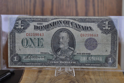 1923 One Dollar Dominion of Canada - VF (Very Fine) - Purple Seal, C Series, Very Rare Type for this Note - McCavour-Saunders - Higher Grade