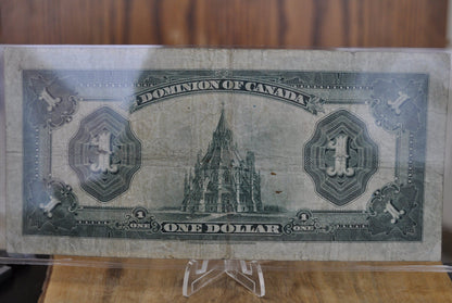 1923 One Dollar Dominion of Canada - VF (Very Fine) - Purple Seal, C Series, Very Rare Type for this Note - McCavour-Saunders - Higher Grade