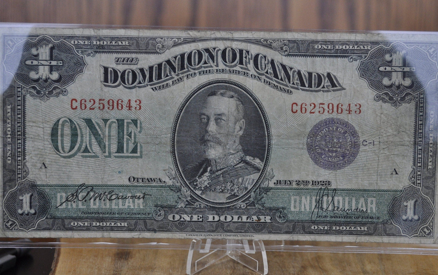 1923 One Dollar Dominion of Canada - VF (Very Fine) - Purple Seal, C Series, Very Rare Type for this Note - McCavour-Saunders - Higher Grade