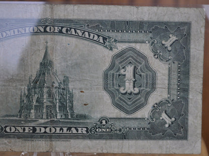 1923 One Dollar Dominion of Canada - VF (Very Fine) - Purple Seal, C Series, Very Rare Type for this Note - McCavour-Saunders - Higher Grade