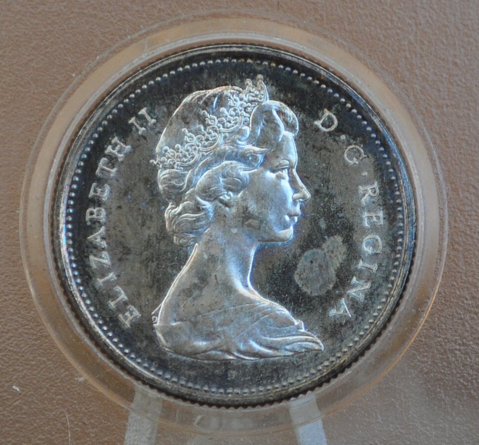 1967 Canadian Silver Quarter - BU (Uncirculated), Prooflike - 80% Silver - Queen Elizabeth II Silver Commemorative Quarter 1967 Canada