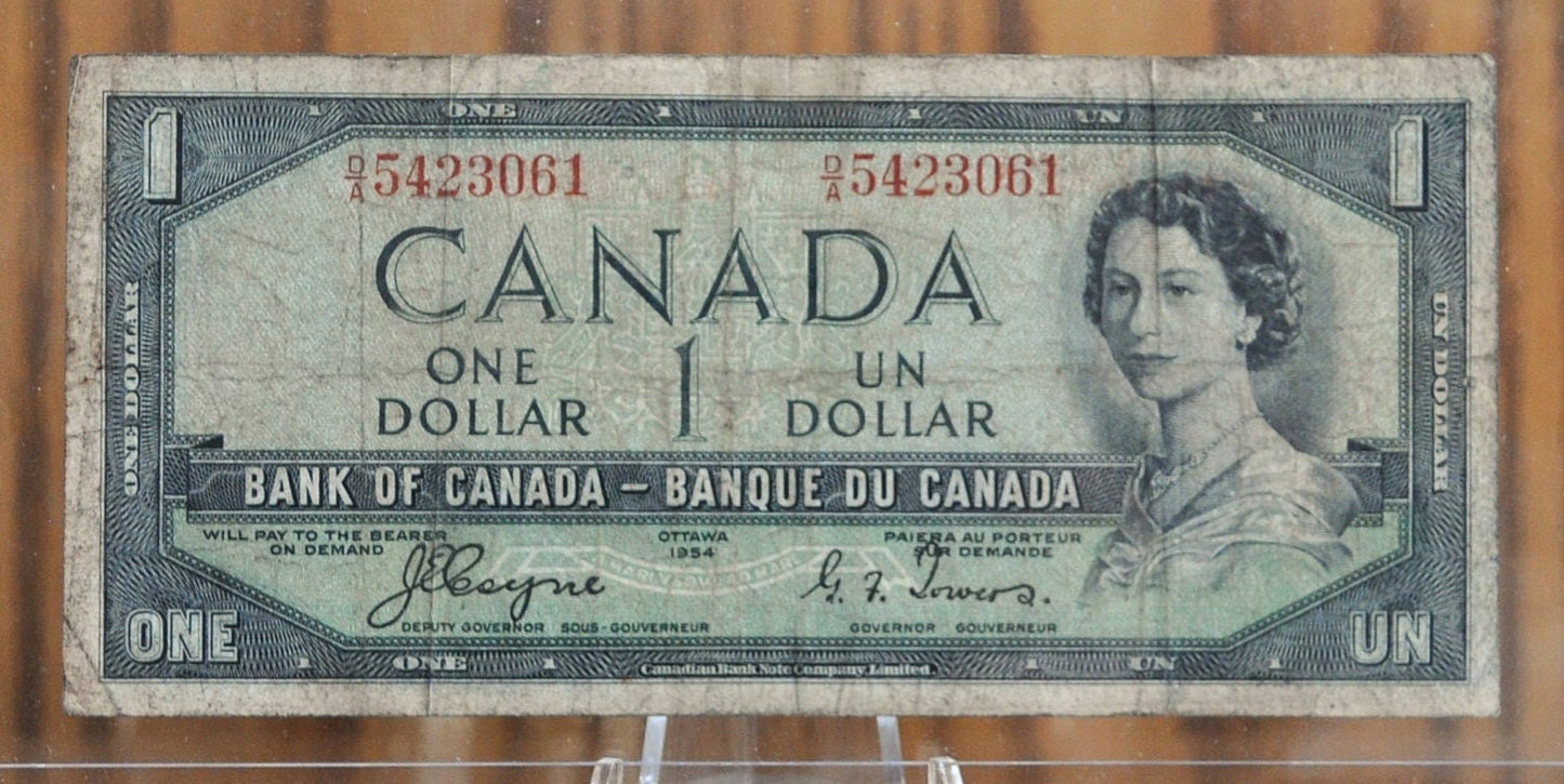 1954 Canadian 1 Dollar Banknote - Devil's Face Hairdo Issue - Coyne/Towers Signatures - 1954 One Dollar Devil's Hair Canada Note - P#66a