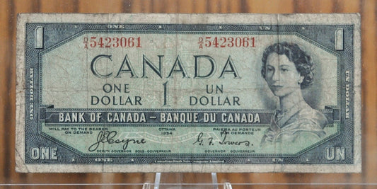 1954 Canadian 1 Dollar Banknote - Devil's Face Hairdo Issue - Coyne/Towers Signatures - 1954 One Dollar Devil's Hair Canada Note - P#66a