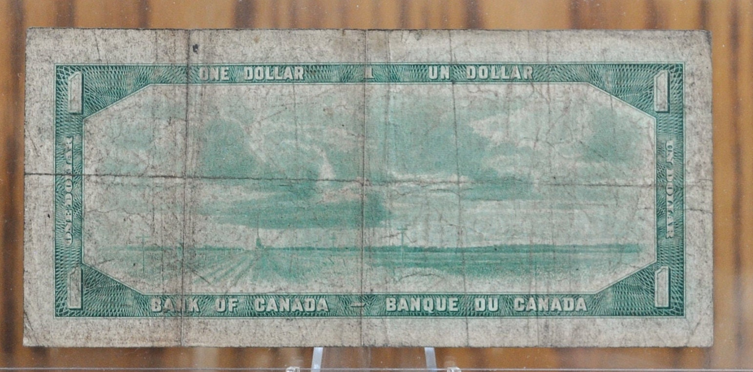 1954 Canadian 1 Dollar Banknote - Devil's Face Hairdo Issue - Coyne/Towers Signatures - 1954 One Dollar Devil's Hair Canada Note - P#66a