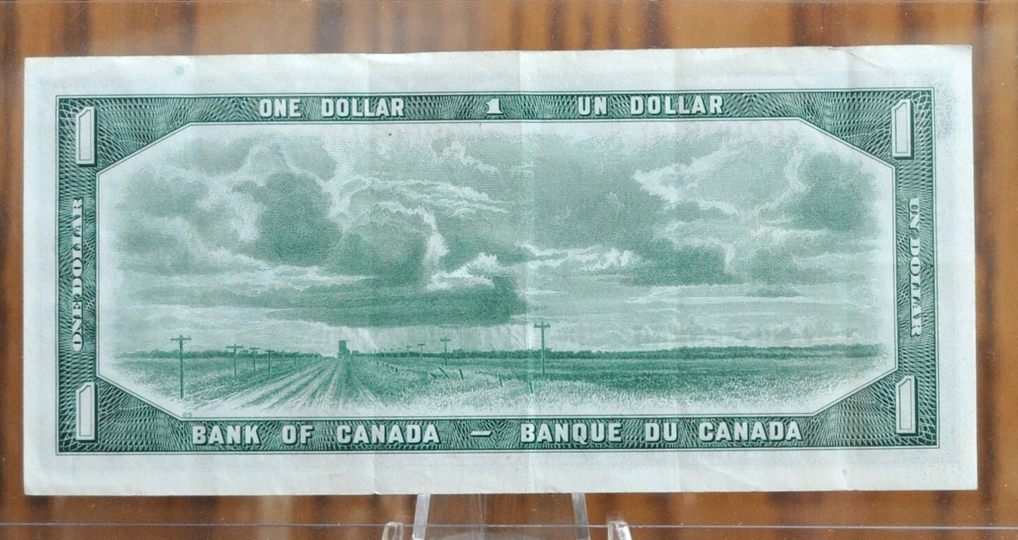 1954 Canadian 1 Dollar Banknote - Devil's Face Hairdo Issue - Beattie/Coyne Signatures - 1954 One Dollar Devil's Hair Canada Note - P#66b