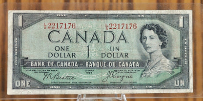 1954 Canadian 1 Dollar Banknote - Devil's Face Hairdo Issue - Beattie/Coyne Signatures - 1954 One Dollar Devil's Hair Canada Note - P#66b