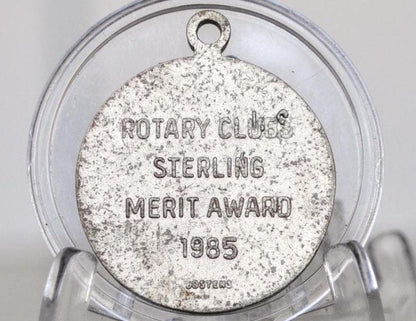 1985 Rotary International Merit Token for Superior Scholastic Achievement - Rotary Class Sterling Metal Award