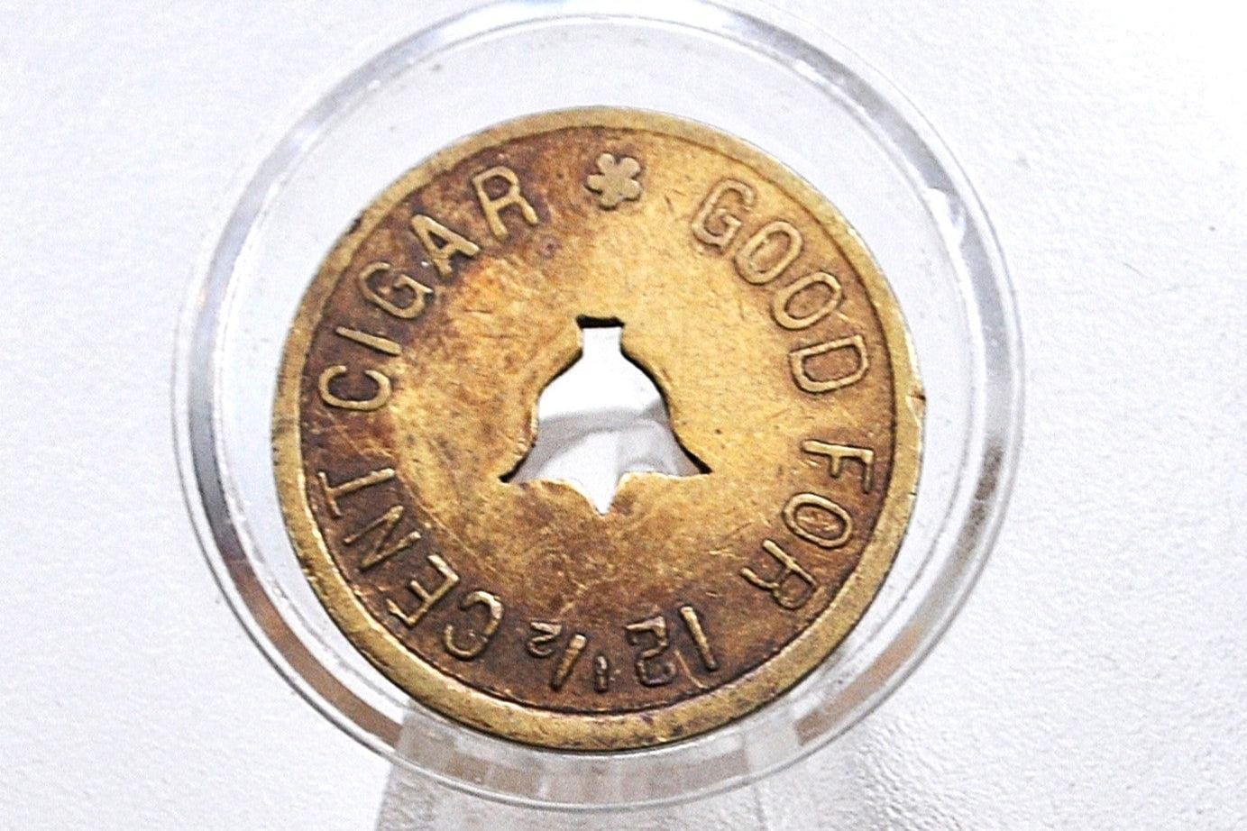 Hemenway and Moser Co., Ogden, Utah "Good For" 12 1/2 Cent Cigar Token with center cut bell shape - Brass Utah Token Hemenway and Moser Co.,