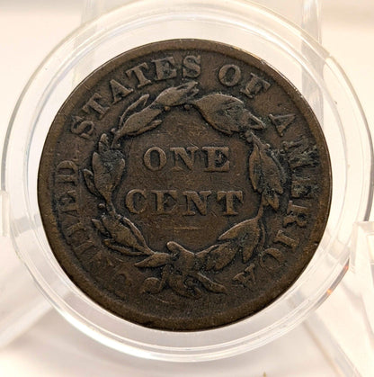 Vintage one cent coin from the United States of America in a clear protective case.