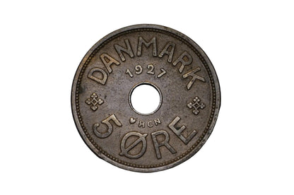 Vintage Danish coin from 1927 on a black background