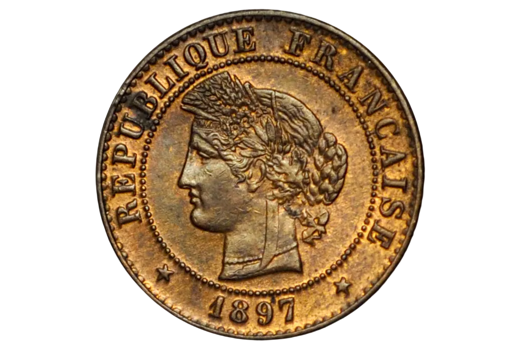 An antique French Republic 1897 coin with a profile portrait of a woman, featuring a warm metallic gold and bronze patina, set against a solid black background.