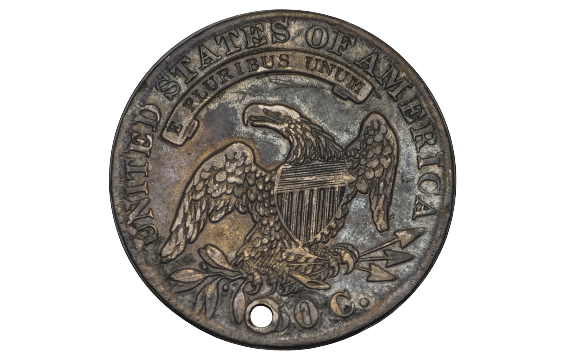 Old coin with 'United States of America' and an eagle emblem on a black background