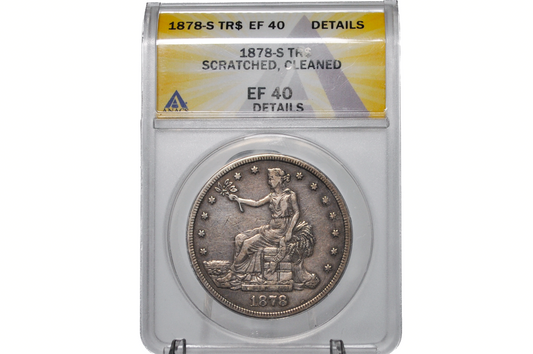 An 1878-S silver dollar coin inside a clear plastic grading slab with a yellow and white label. The slab reads '1878-S TR$ EF 40 DETAILS' and '1878-S Thr.
