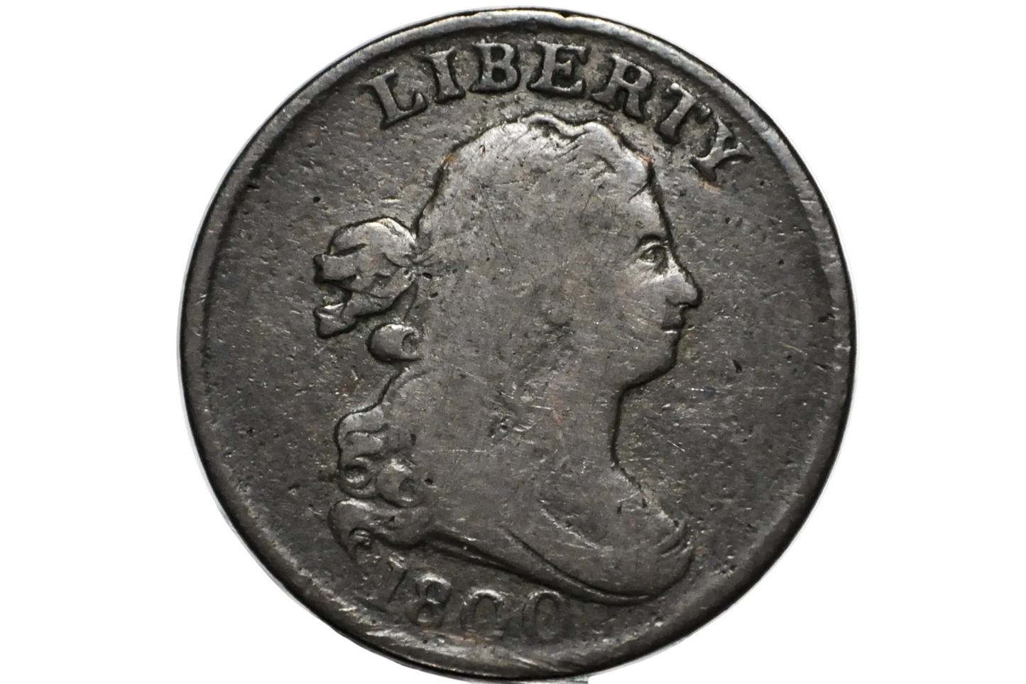A close-up of an 1800 US Half Cent coin featuring a profile portrait of Lady Liberty with the word 'LIBERTY' above and '1800' below, displayed inside a clear protective plastic holder.