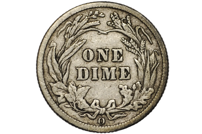 A close-up of a vintage US one dime silver coin inside a clear plastic protective capsule, showing the detailed wreath design and 'ONE DIME' text.