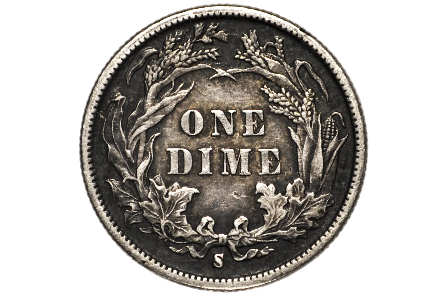 A vintage US one dime silver coin with a wheat wreath and 'ONE DIME' text, displayed inside a clear plastic protective capsule. S Mint Mark