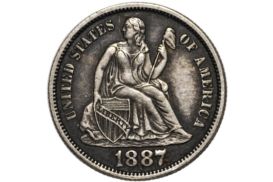 An 1887 United States silver Dime featuring a seated female figure holding a shield and torch, with the text 'UNITED STATES OF AMERICA' and '1887' visible, photographed inside a clear protective plastic holder.