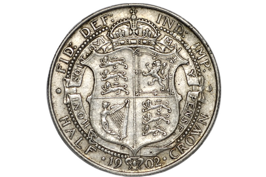 A silver 1902 British Crown Half Crown coin, showing the reverse side with the Royal Coat of Arms, displayed inside a clear plastic protective capsule.